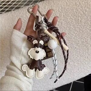 Brown and White Dog Keychain with Baseball